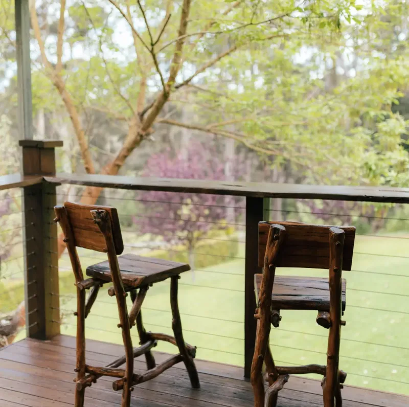 Two chairs on a balcony